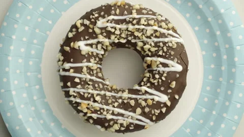 Doughnut glazed close-up. Seamless looping. Video stock 139948711