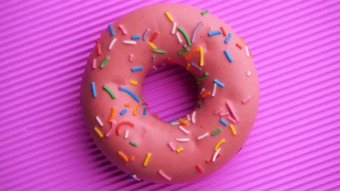 Doughnut glazed close-up. Seamless looping. 스톡 동영상 140879865