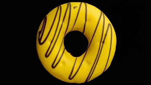 Doughnut glazed close-up. Seamless looping. Stock Footage 144802372