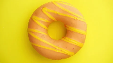 Doughnut glazed close-up. Seamless looping. 스톡 동영상 144802514