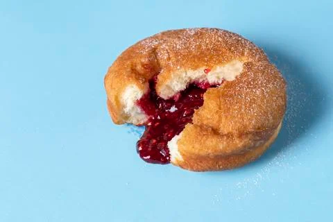 Doughnut with jam. Berliner donut with raspberry filling. German food Stock Photos