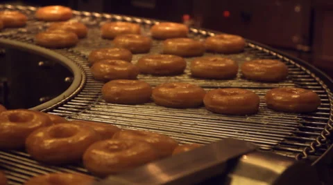 Doughnut on machine Stock Footage 60592336