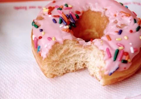 Doughnut with missing bite Stock Photos
