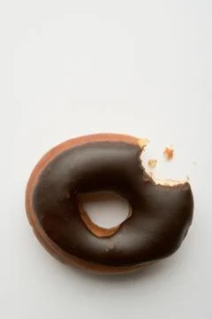 Doughnut with missing bite Foto stock