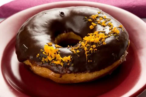 Doughnut with orange Stock Photos