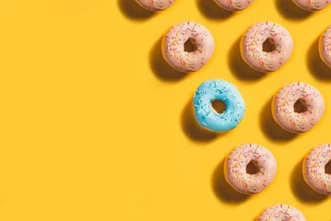 Doughnut pattern banner with blue donut accent Stock Photos