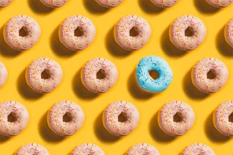 Doughnut Pattern with blue accent on yellow background Stock Photos