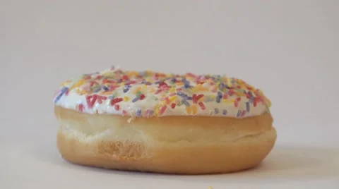 Doughnut pull focus disappearing unhealthy eating concept 4k Stock Footage 56739422