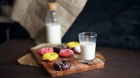 Doughnut served with a mini bottle of milk Stock Footage 61448389