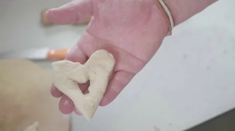 Doughnut in shape of heart Stock Footage 60689300