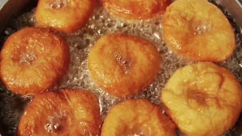 Doughnuts are fried in oil Stock Footage 70931820