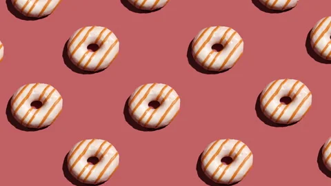 Doughnuts on a background flashing with different colors. Stock Footage 151547572