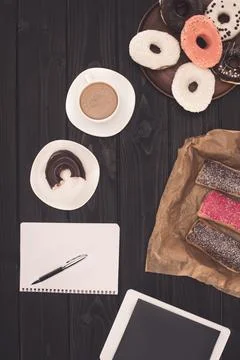Doughnuts coffee and digital tablet Stock Photos