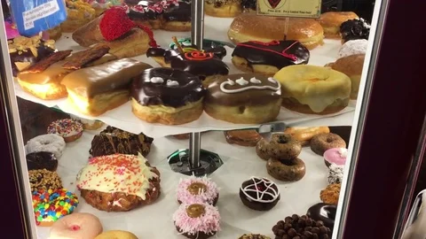 Doughnuts in Display Case Stock Footage 73967198
