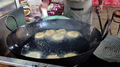 Doughnuts on a frying pan Stock Footage 232351861