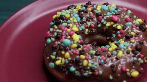 Doughnuts That Rotate 360 Degrees on the Plate Stock Footage 248569308