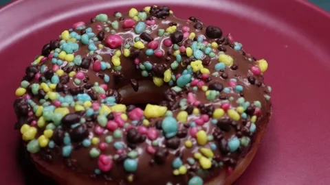 Doughnuts That Rotate 360 Degrees on the Plate Stock Footage 248569309