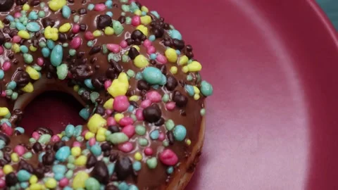 Doughnuts That Rotate 360 Degrees on the Plate Stock Footage 248569665