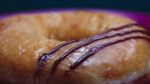 Doughnuts That Rotate 360 Degrees on the Plate Stock Footage 248571196