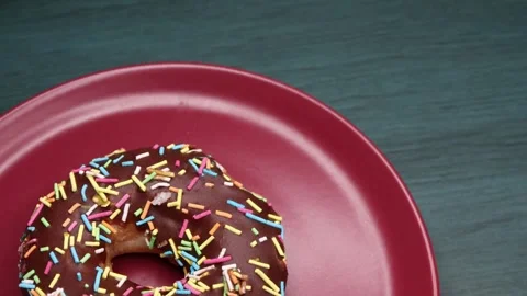 Doughnuts That Rotate 360 Degrees on the Plate Stock Footage 248571444