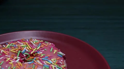 Doughnuts That Rotate 360 Degrees on the Plate Stock Footage 248572620