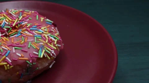 Doughnuts That Rotate 360 Degrees on the Plate Stock Footage 248572624