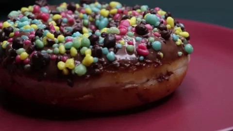 Doughnuts That Rotate 360 Degrees on the Plate Stock Footage 248572711