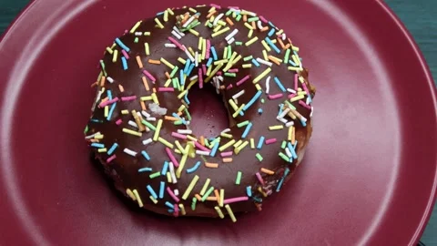 Doughnuts That Rotate 360 Degrees on the Plate Stock Footage 248572958