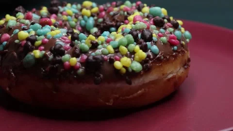 Doughnuts That Rotate 360 Degrees on the Plate Stock Footage 248573094