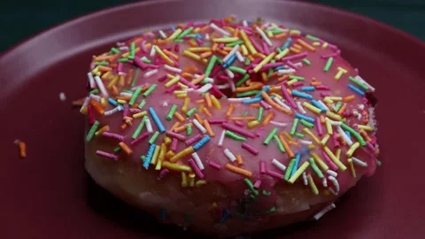 Doughnuts That Rotate 360 Degrees on the Plate Stock Footage 248573181