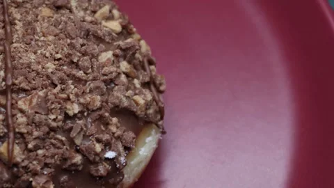 Doughnuts That Rotate 360 Degrees on the Plate Stock Footage 248573322