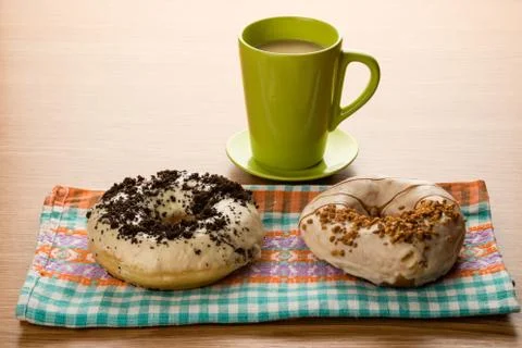 Doughnuts on tablecloth Stock Photos
