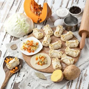 Doughs lean food. Process of making dumplings with potatoes and pumpkin Stock Photos