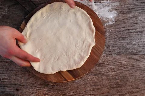Dought for italian pizza preparation, copy text Stock Photos