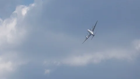 Douglas DC-6b airshow flight demonstration in blue sky with clouds Stock Footage 86523678