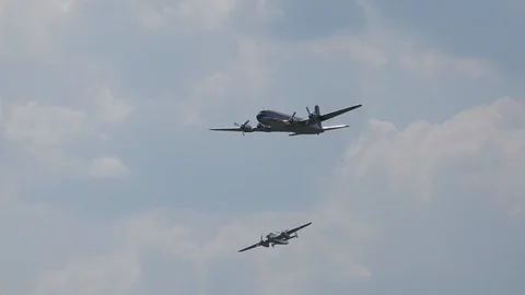 Douglas DC-6b and North Amercian B-25J Mitchell airshow flight demonstration Stock Footage 86516980