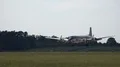 Douglas DC-6b land on airfield runway with landing gear 4k or 4k+ Resolution