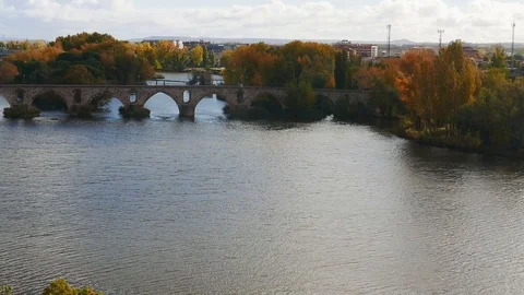 Douro River as it passes through Zamora, Spain. Zoom out Stock Footage 99143355