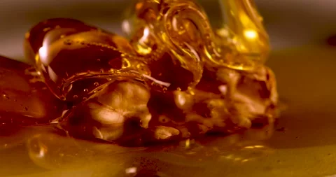 Dousing a walnut with honey Stock Footage 254690695