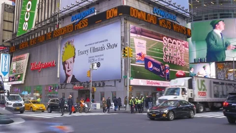 Dow Jones news ticker at the corner of 42nd street and 7th avenue in New York Ci Stock Footage