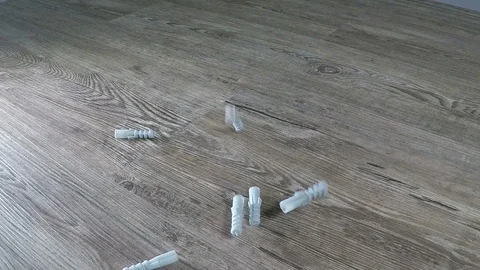 Dowels falling onto a wooden table Stock Footage 122829054