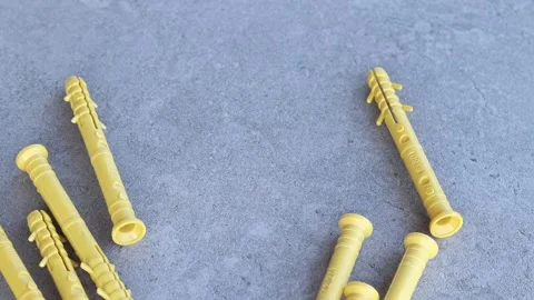 Dowels for quick installation are spilled out on a gray surface Stock Footage 340424090