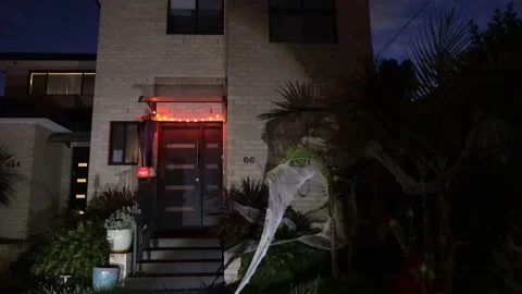 Down along facade of Halloween decorated house in Australia, 4k. Stock Footage 163848136