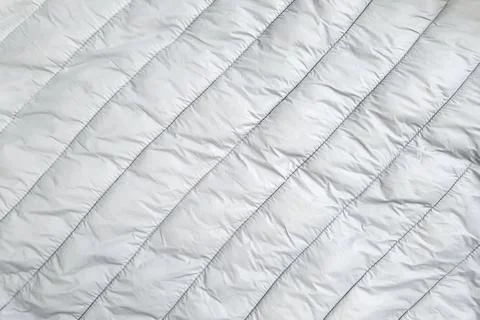 Down jacket fabric background, gray puffer jacket texture Stock Photos