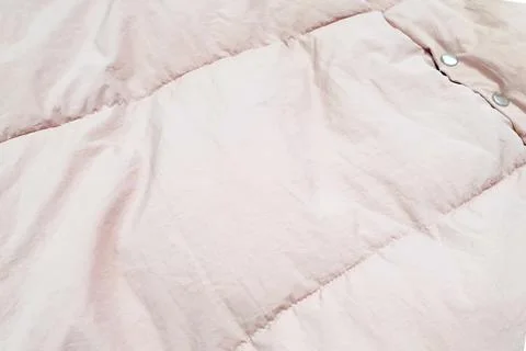 Down jacket fabric background, light pink puffer jacket texture Stock Photos