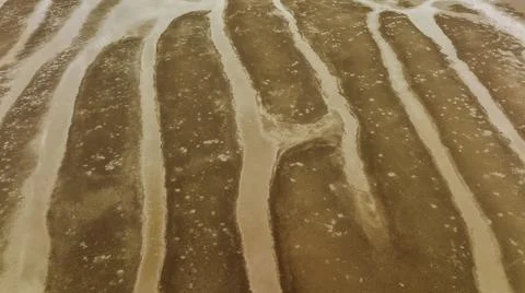 Down Low Drone View Of Patterns In The Sand Stock Photos