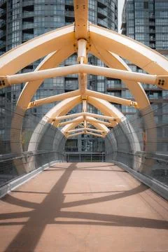 Down   the   middle   of   a   white   bridge   with   white   bars Stock Photos