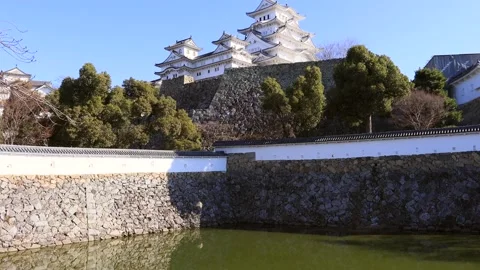 Down overview of the main white tower in historic Himeji park of Japan, 4k. Stock Footage 144099978