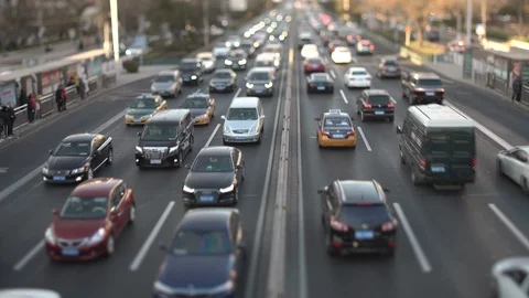 Down shot traffic flowing with tilt shift lens at sunset Stock Footage 121317738