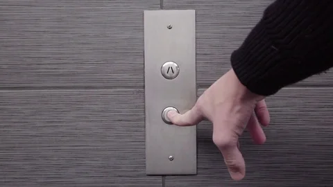 DOWN Silver Elevator Button with Slate Tile Stock Footage 71287387